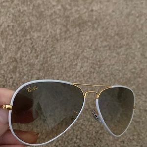 Like new Ray Ban gold/white aviator sunglasses.
